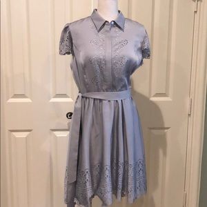 Pretty grey dress with lots of details.